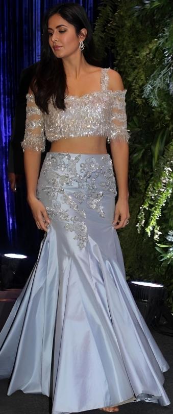 Dressed in a mesmerizing powder blue lehenga adorned with delicate tassels and a stunning blouse, also designed by the maestro Manish Malhotra, Katrina graced the Anushka Sharma and Virat Kohli reception with her ethereal presence.